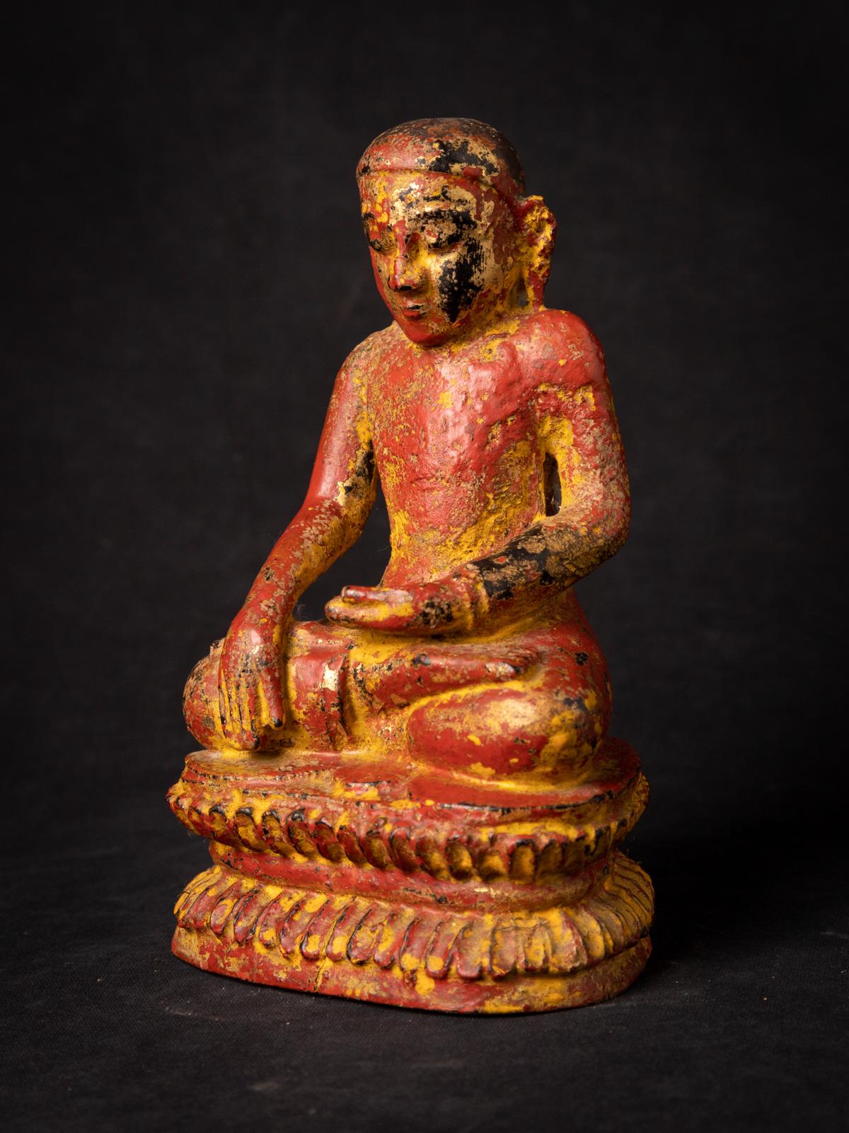 The very early old wooden Burmese Monk statue is a captivating relic that offers a rare glimpse into the artistic and spiritual heritage of Burma. Carved from wood, this statue stands at a height of 19.3 cm, with measurements of 11.8 cm in width and