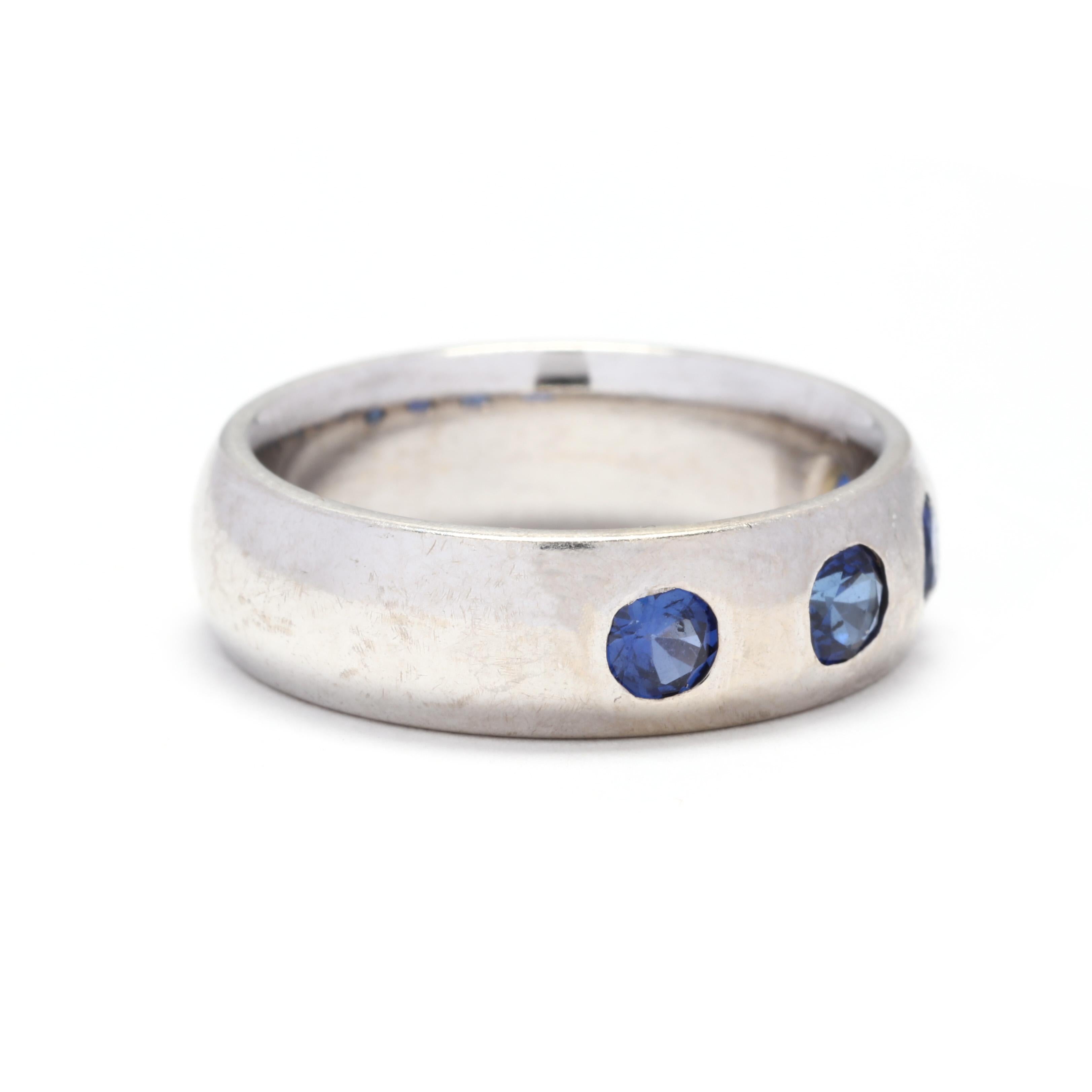 A vintage 14 karat white gold sapphire flush set ring. This ring features a 6mm slightly domed band with four gypsy set cushion cut cornflower blue sapphires weighing approximately 1.76 total carats.

Stones:

- sapphires, 4 stones

- cushion cut

-