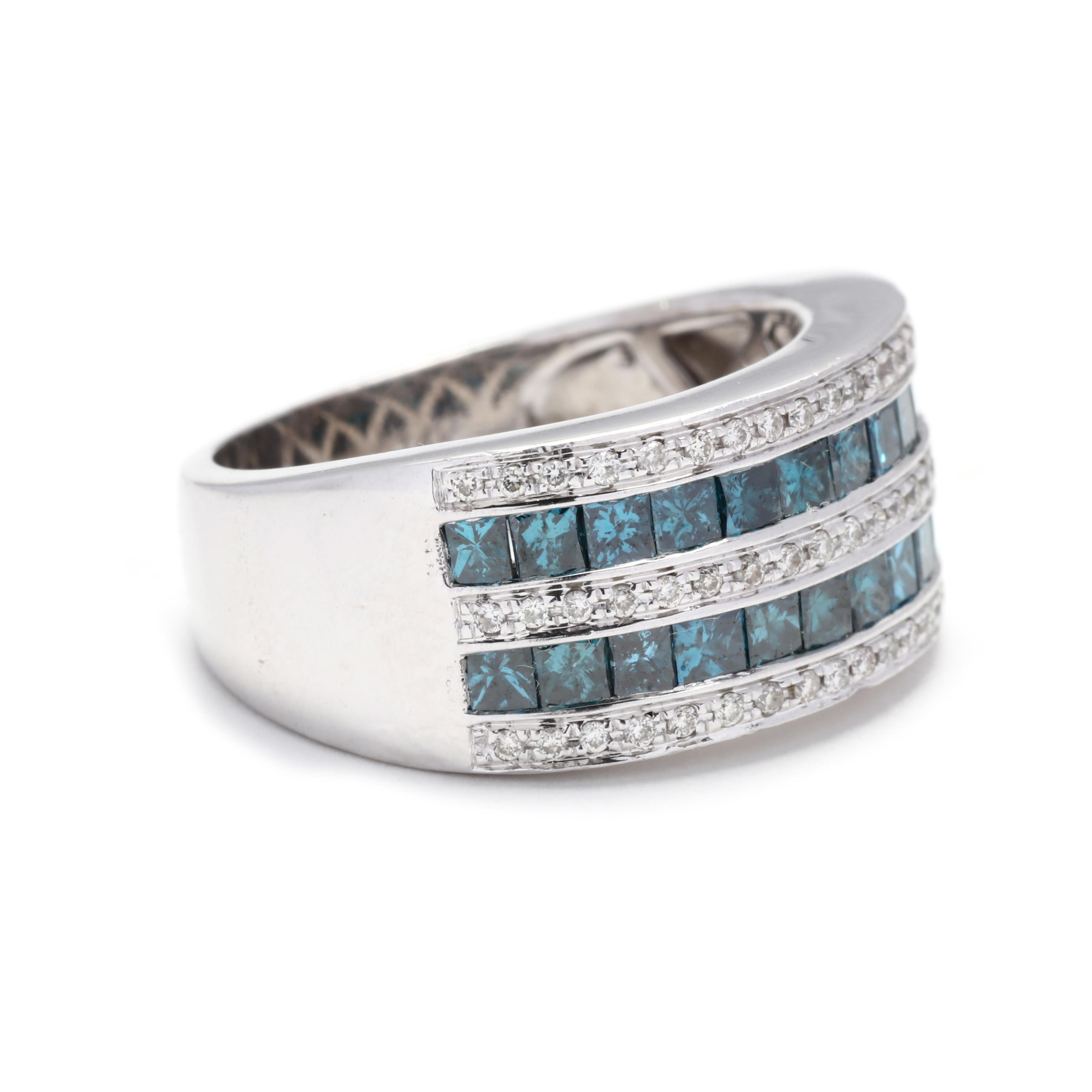 A 14 karat white gold blue and white diamond wide band ring. This band features two rows of channel set princess cut blue diamonds weighing approximately 1.44 total carats with a row of full cut white diamonds down the center and on either side with