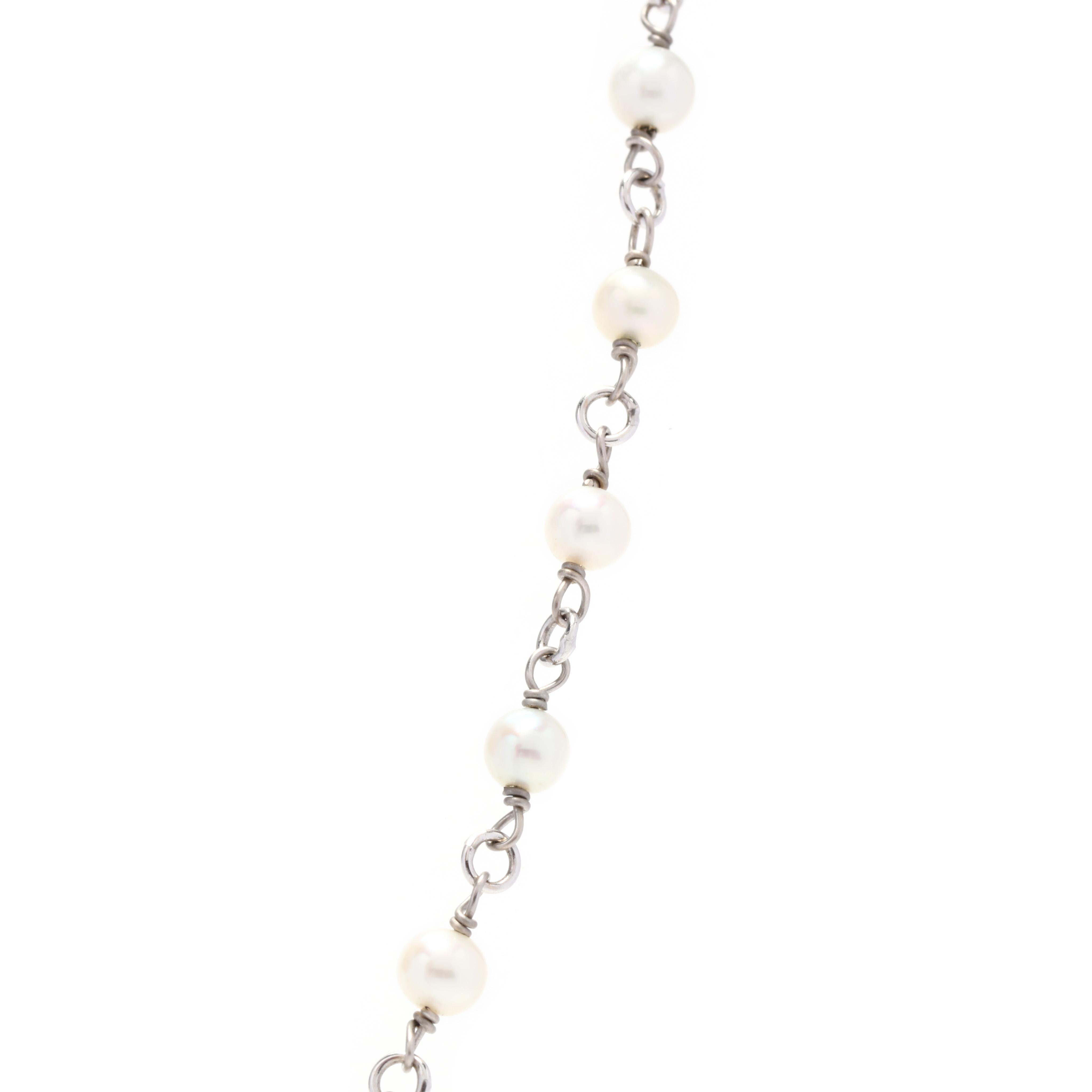 A vintage 14 karat white gold pearl necklace. This necklace features alternating small white pearl beads with chain links and a lobster clasp.

Stones:
- pearls, 44 stones
- round beads
- 3.5 - 3.75 mm

Length: 18 in.

Weight: 3.6 dwts.

Ring