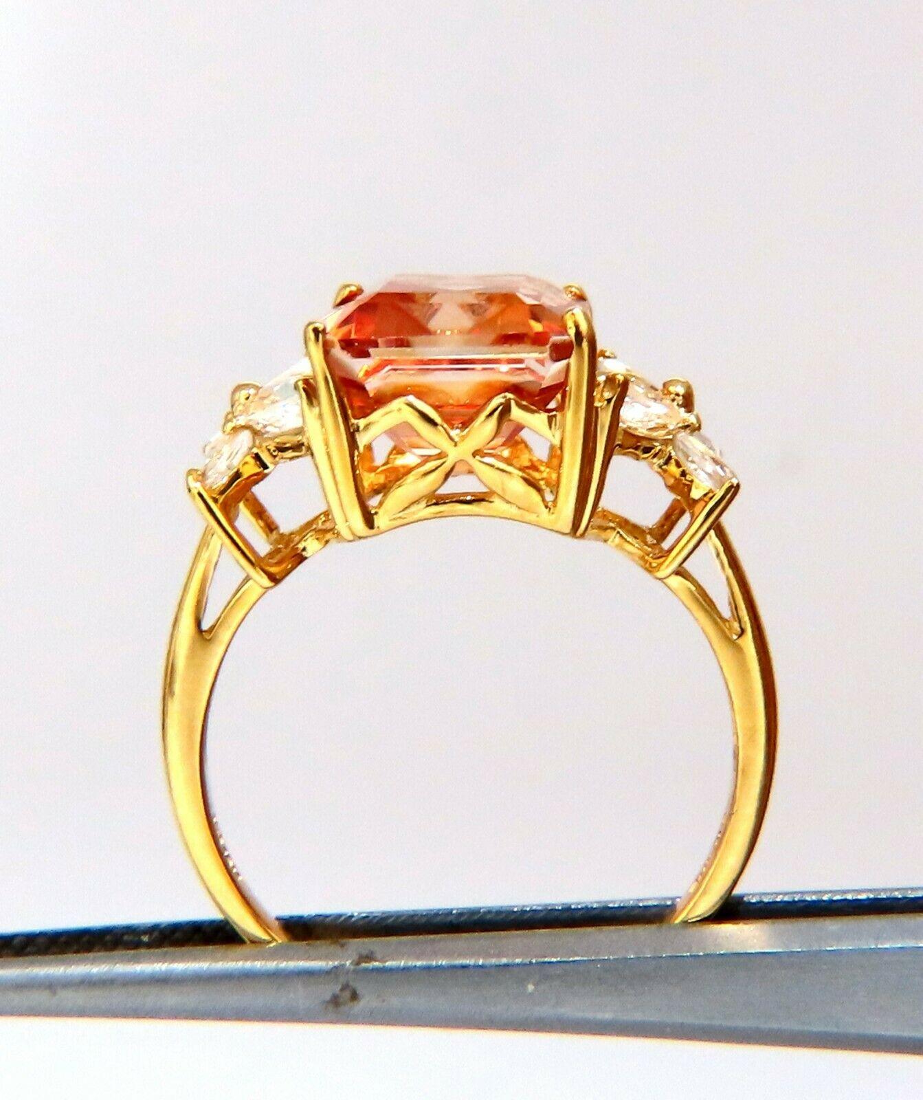 Cubic Zirconia Diamond Ring.

14x10 cz, fancy color orange.

Natural side Marquise diamonds, .50ct.

10kt yellow gold. 5.4 Grams

depth of ring 8.3 mm

Size 10 and we may resize.