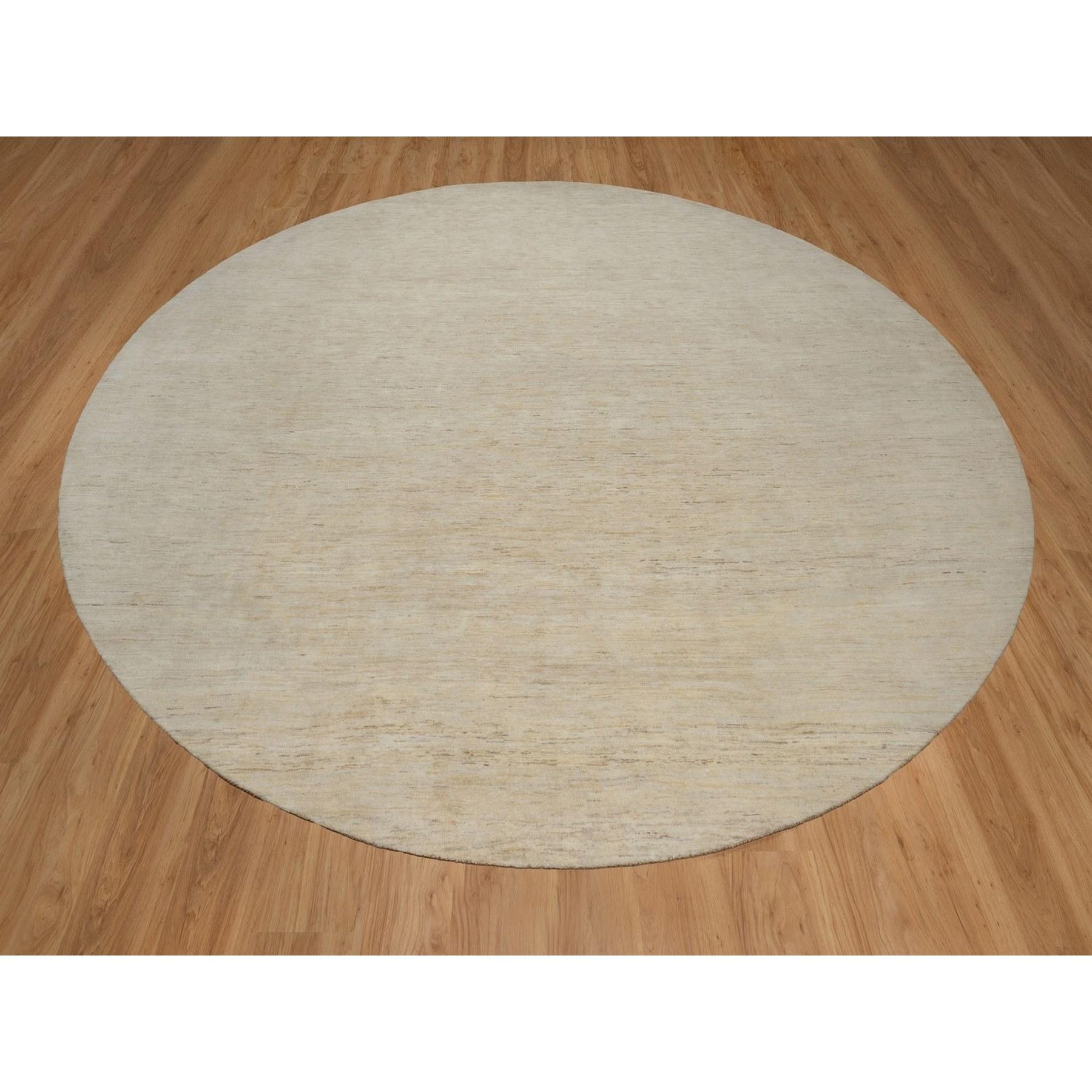 Chiffon White, Lori Buft Gabbeh, Modern, Plain Design, Thick and Plush, Undyed Natural Wool, Hand Knotted, Round, Oriental Rug
Primary materials: Wool
Latex: No Pile 
height: 0.25 Inches
Style: Contemporary
Primary color: Ivory
Secondary colors: