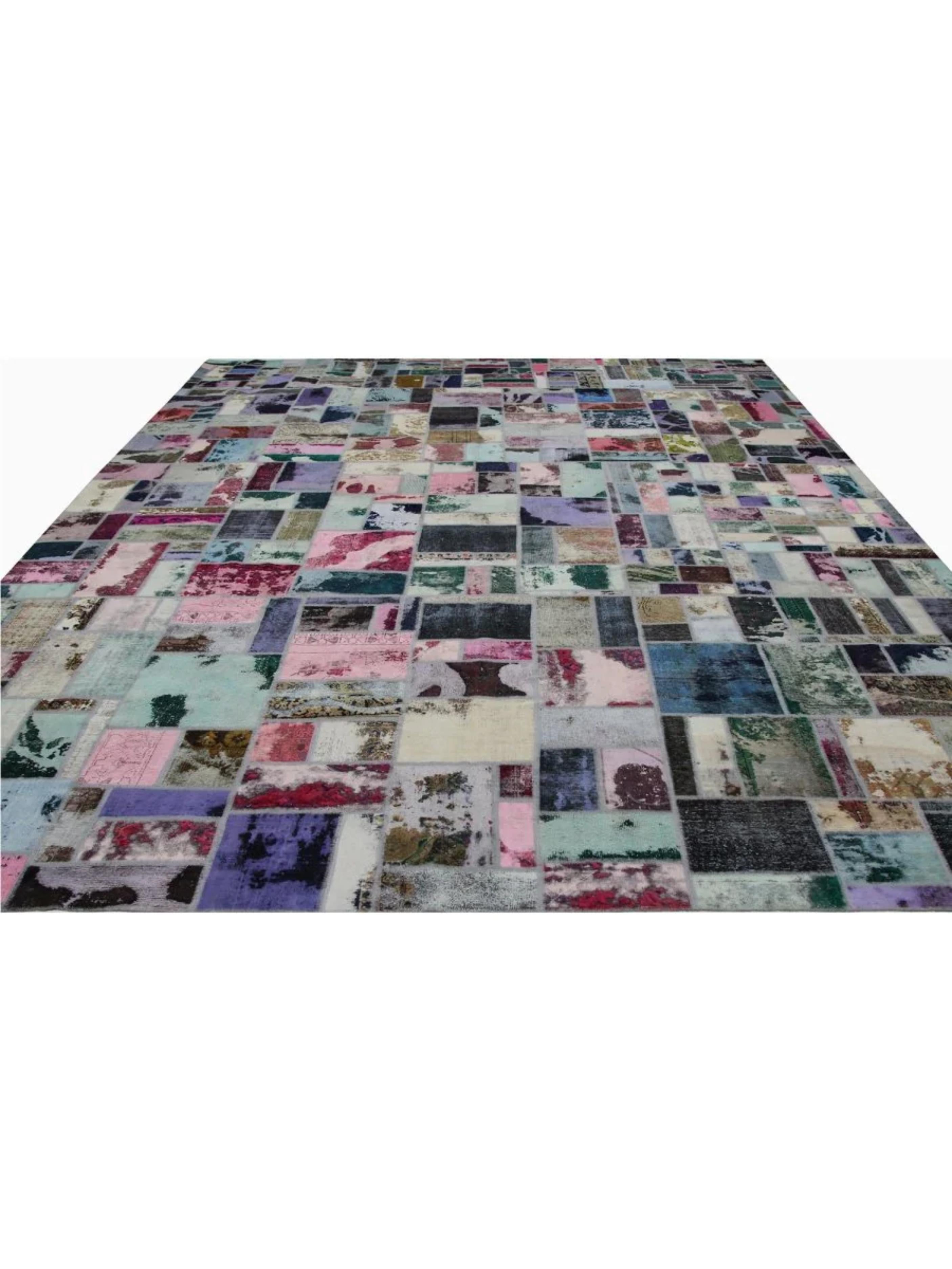 Elevate your living space with the 14x20 Vintage Distressed Patchwork Area Rug, a truly one-of-a-kind creation that seamlessly combines timeless craftsmanship with modern design. Hand-knotted from premium wool, this rug features a captivating