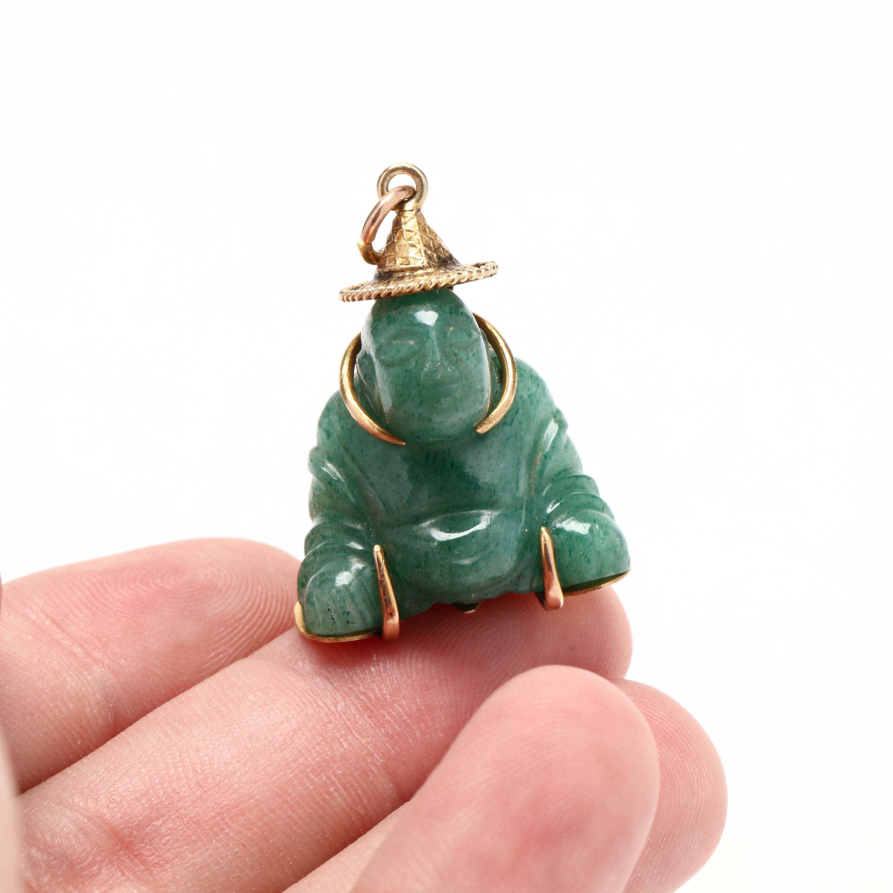 A vintage 14 karat yellow gold carved aventurine quartz buddha charm. This charm features a carved green aventurine quartz stone in a buddha motif with an engraved mounting and hat.



Length: 1 1/4 in.



Width: 7/8 in.



Weight: 6.4 dwts.