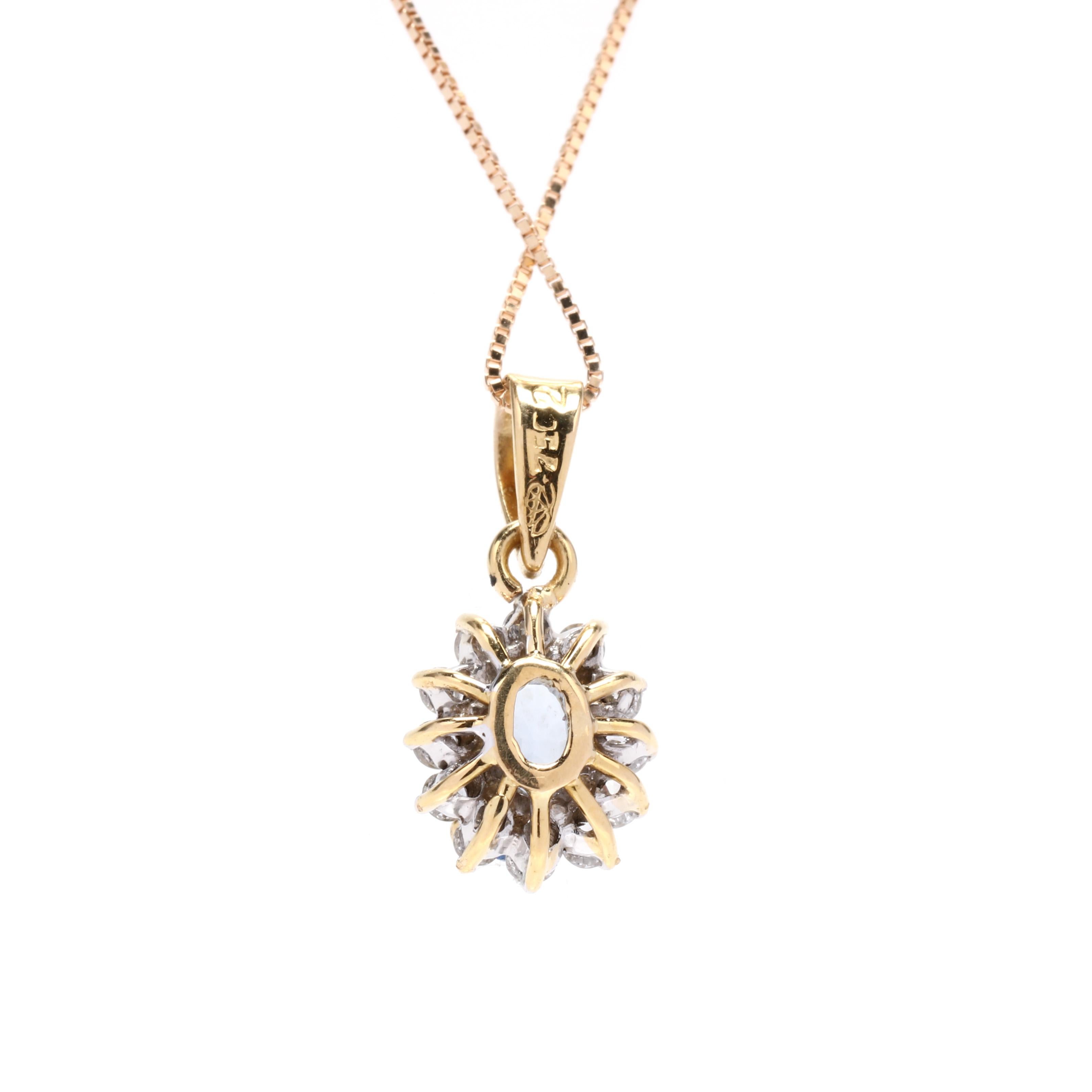 An 14 karat yellow gold sapphire and diamond halo pendant necklace. This pendant features a prong set, oval cut light blue sapphire weighing approximately 1.10 carat surrounded by a diamond halo weighing approximately .24 total carats suspended from