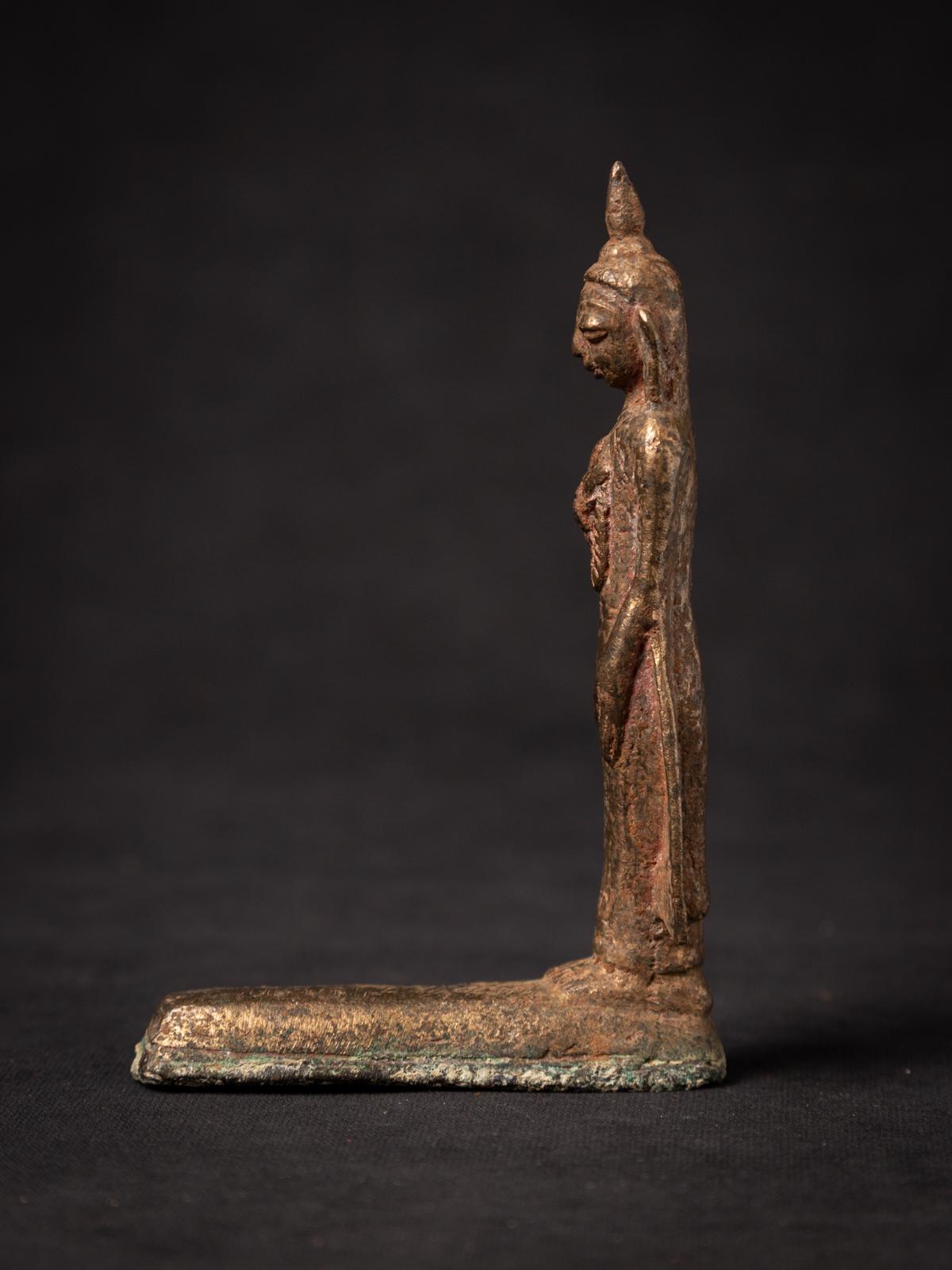 The Antique bronze Burmese Buddha statue is a remarkable and spiritually significant artifact originating from Burma. Crafted from bronze , each statue stands at 12,3 cm in height and measures 3,7 cm in width and 8,1 cm in depth. 

Created in the
