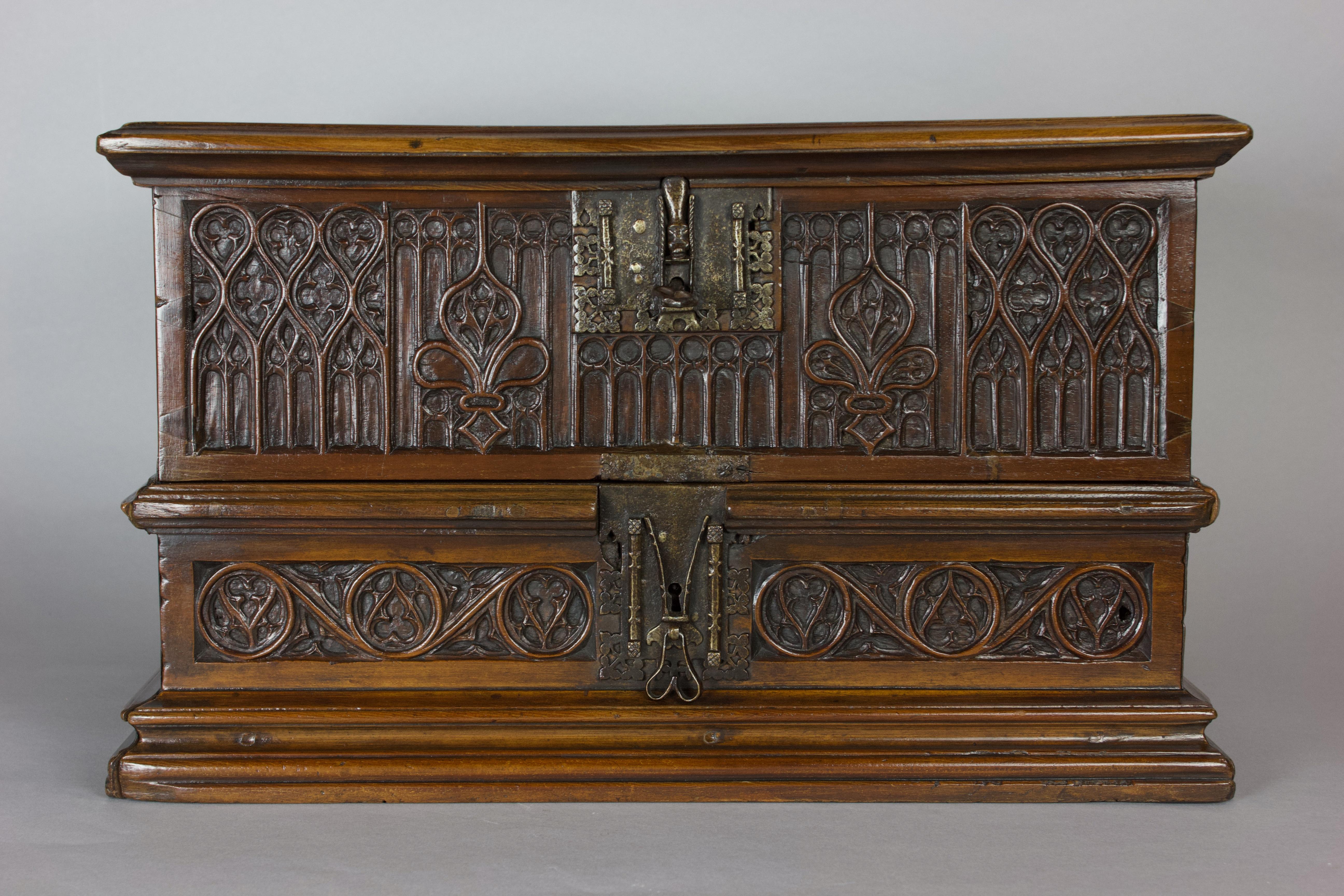 A very rare Spanish 15th/16th Century walnut casket, also known as an arqueta. 

Circa 1500.

Exceedingly finely decorated with Gothic decoration and original elaborate metalwork.

The top and back are embellished with a multitude of relief cast St