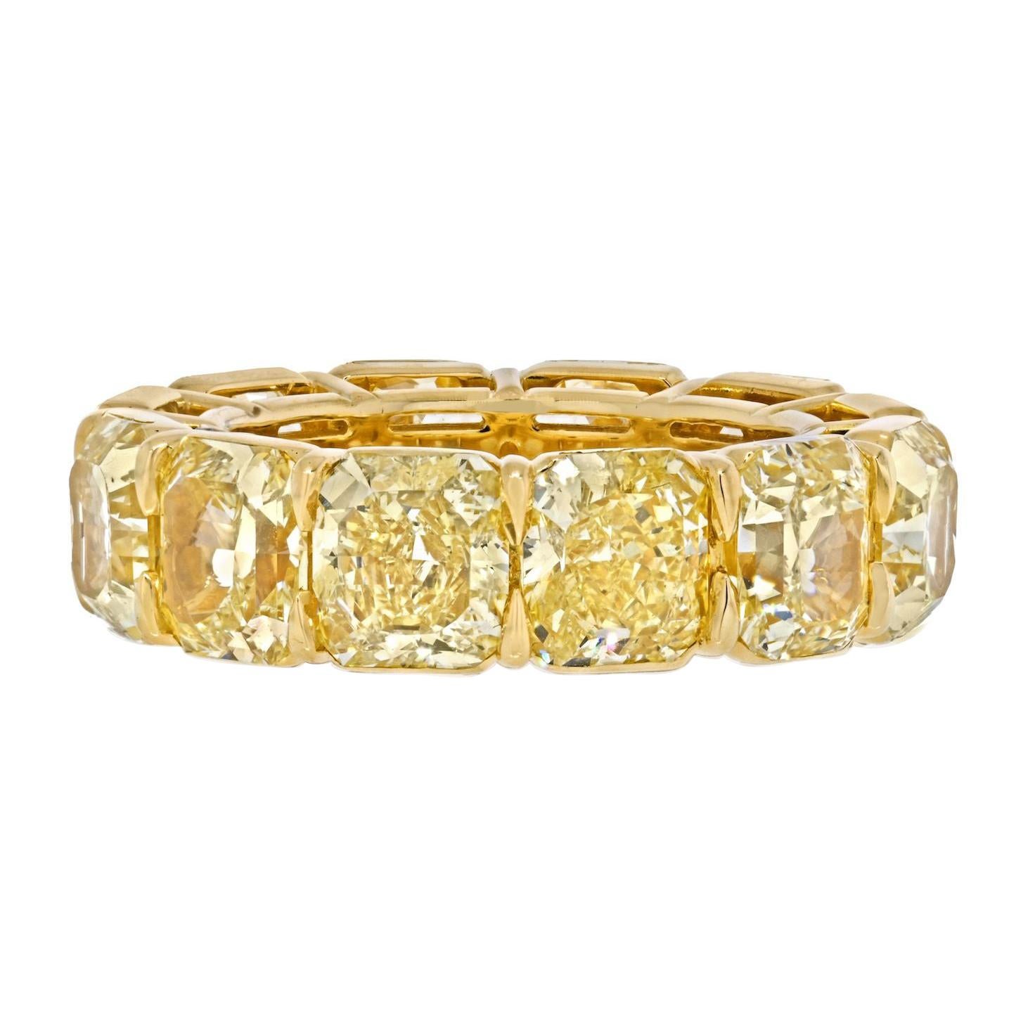 15 Carat 18K Yellow Gold Radiant Cut Fancy Yellow Diamond Eternity Band.
Mounted with 12 GIA certified diamonds. Finger size: 6.75. 
Color: Certified fancy yellow
Clarity: all certified VVS2 through SI1 
Certificates: GIA 

Dazzling diamond eternity