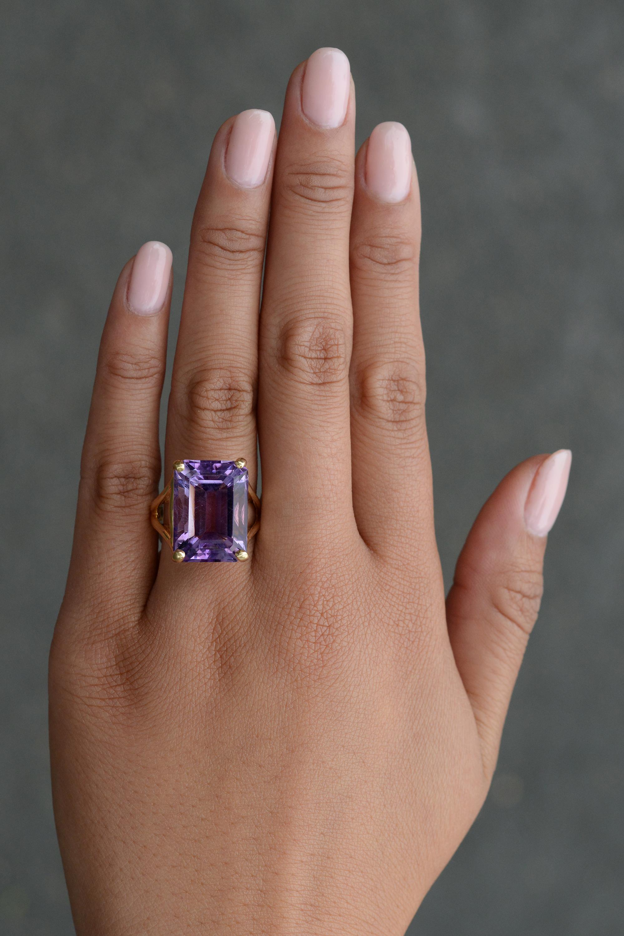 This luxurious estate cocktail ring is a rare find at an awesome value and perfect for your vintage collection. Bespoken with 14 karat yellow gold, and embellished with a dazzling and lovely-hued violet amethyst weighing 15 carats in a smart 