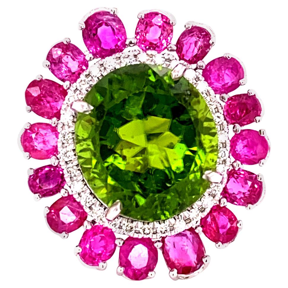 15+ Carat Burmese No Heat Peridot, Burmese Ruby, and Diamond Gold Cocktail Ring:

An eye-catching ring, it features a No Heat Burmese Peridot weighing 15 carat, surrounded by a halo of white round diamonds and No Heat Burmese Rubies weighing nearly
