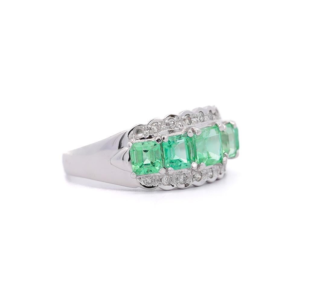 1.50 Carat Emerald and Diamond Band Ring in Platinum Tapered Band. 5 enchanting pastel green Emeralds are lined up front and center between two strips of 8 shiny round cut diamonds. Statement piece with a vintage flair. Weighs 4.70 grams, has a Band
