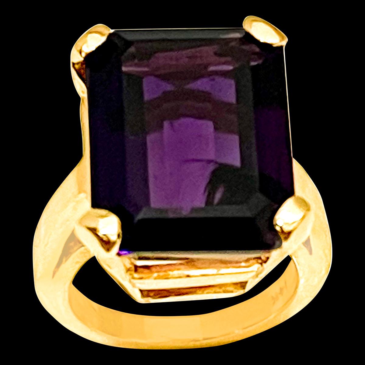 Approximately 15 Carat Emerald Cut Amethyst  Cocktail Ring in 14 Karat Yellow Gold Size 5
18 x 14 MM Amethyst  Cocktail Ring in 14 Karat Yellow Gold 

This is a Beautiful Cocktail ring ring which has a large approximately 15 carat of  Amethyst .