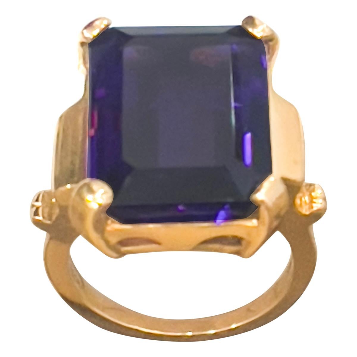 Approximately 15 Carat Emerald Cut Amethyst  Cocktail Ring in 14 Karat Yellow Gold Size 6.5
18 x 14 MM Amethyst  Cocktail Ring in 14 Karat Yellow Gold 

This is a Beautiful Cocktail ring ring which has a large approximately 15 carat of  Amethyst .