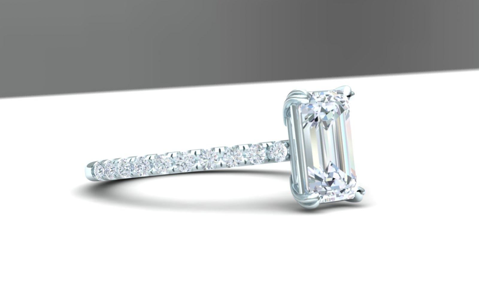 Here is a simple but stunning diamond ring that anyone would be excited to open.  The center stone is a emerald cut that is GIA certified and weighs 1.5 carats and a color and clarity of H-VS2.  The center stone is set in a 18k white gold mounting