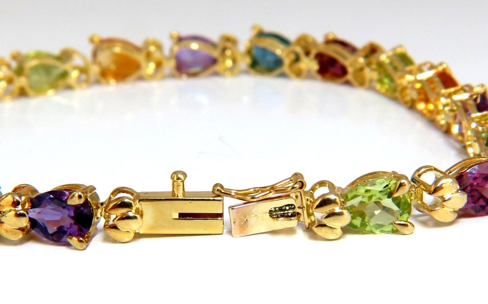 Gem Line.

15.00ct. Natural Garnet, Amethyst, 

Citrine, Peridot & Blue Topaz bracelet.

Full Pear cuts, great sparkle.

Multicolor Rainbow colors.

Vibrant Greens, Orange, Reds, yellows, Blues & Purple

Clean Clarity & Transparent.

Averaging 6 x