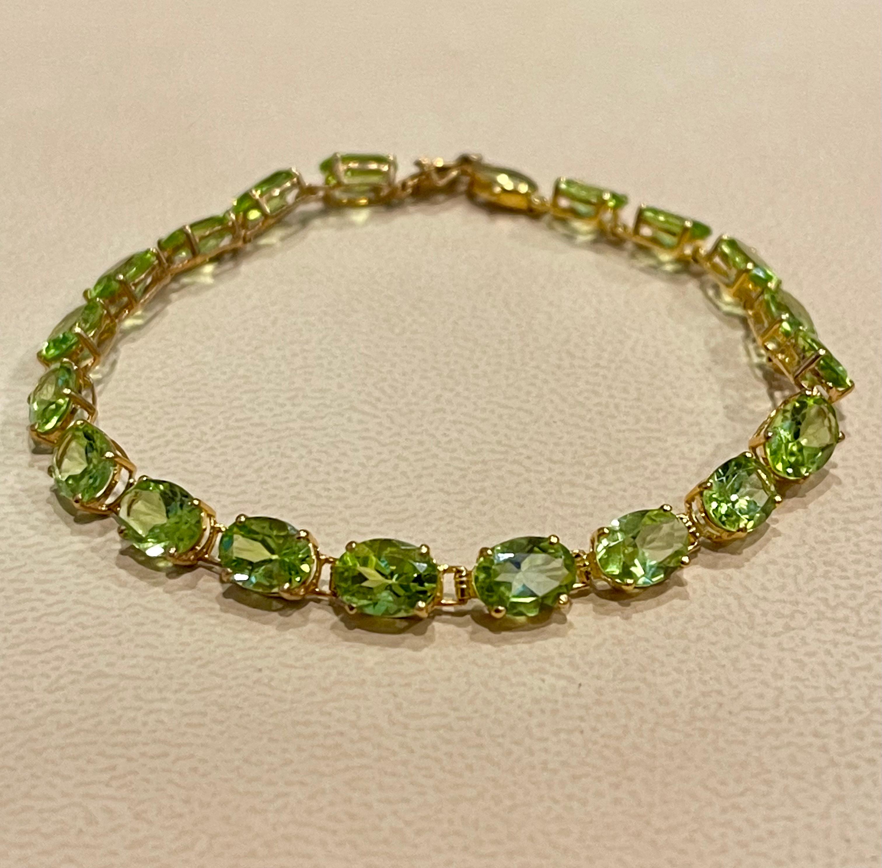  This exceptionally affordable Tennis  bracelet has  19 stones of Pear shape Peridot
Beautiful colors , very Vibrant
Size of the stone is approximately 7X5 mm
Each Peridot is spaced by a small gold link

Total weight of these Peridot is