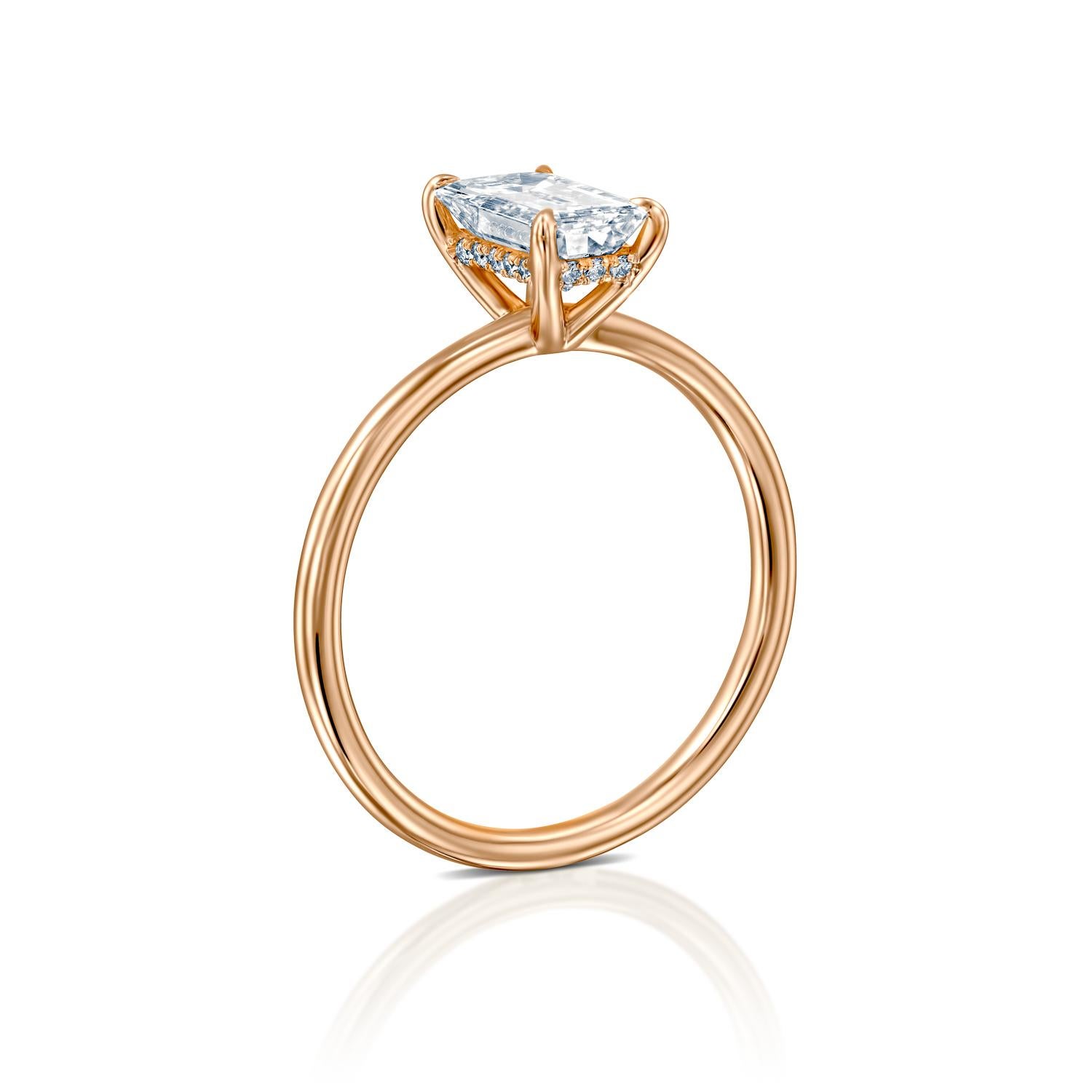 1.5 carat emerald cut diamond ring on hand