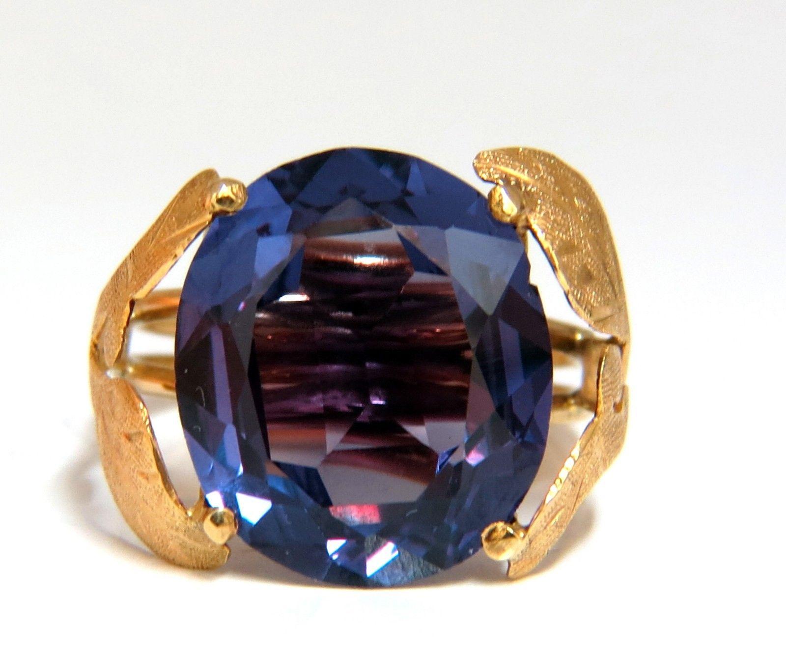 15ct. Lab Created Alexandrite ring.
Full cut brilliant Oval cut

 Clean clarity 

Transparent and vibrant Bluish / Indigo / violet

16.3 X 14mm

Lab Grown / Synthetic 

Synthetic 
14kt. yellow gold 

6 Grams

 Depth of ring: 10mm 

Current ring