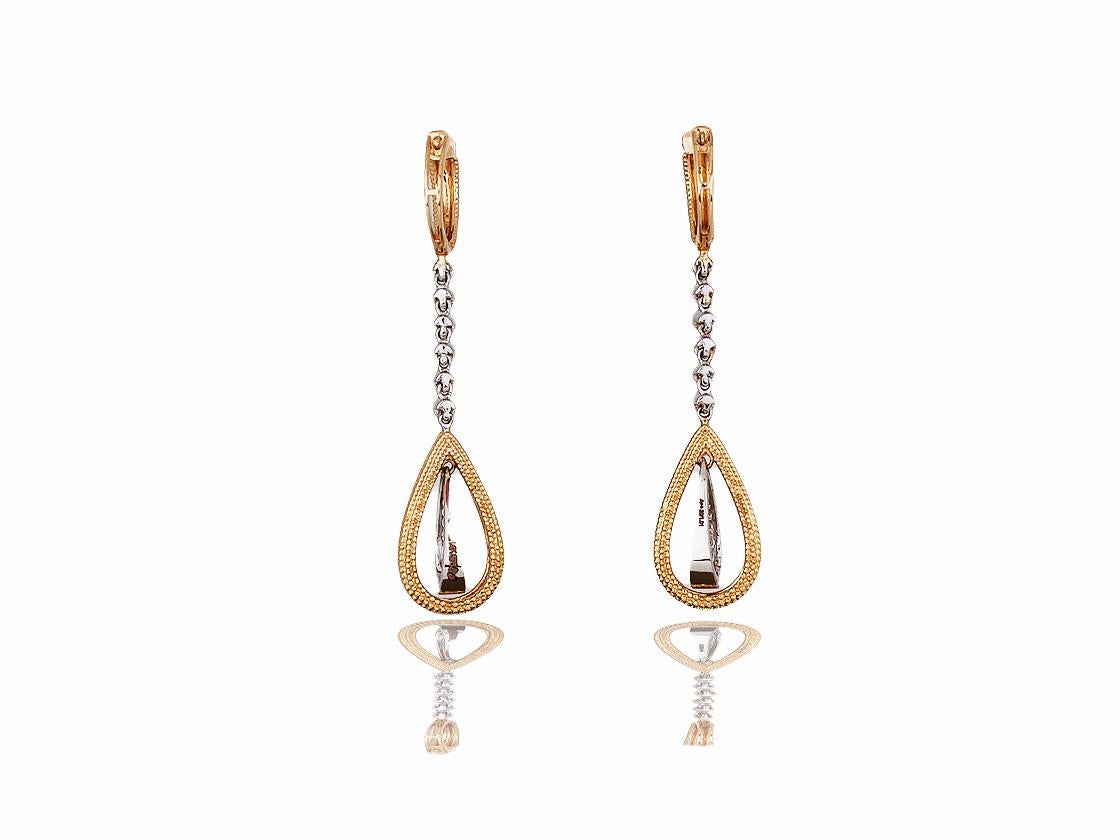 These stunning earrings are handmade from 18k white and yellow gold.  These dangling beauties measure 2.25 