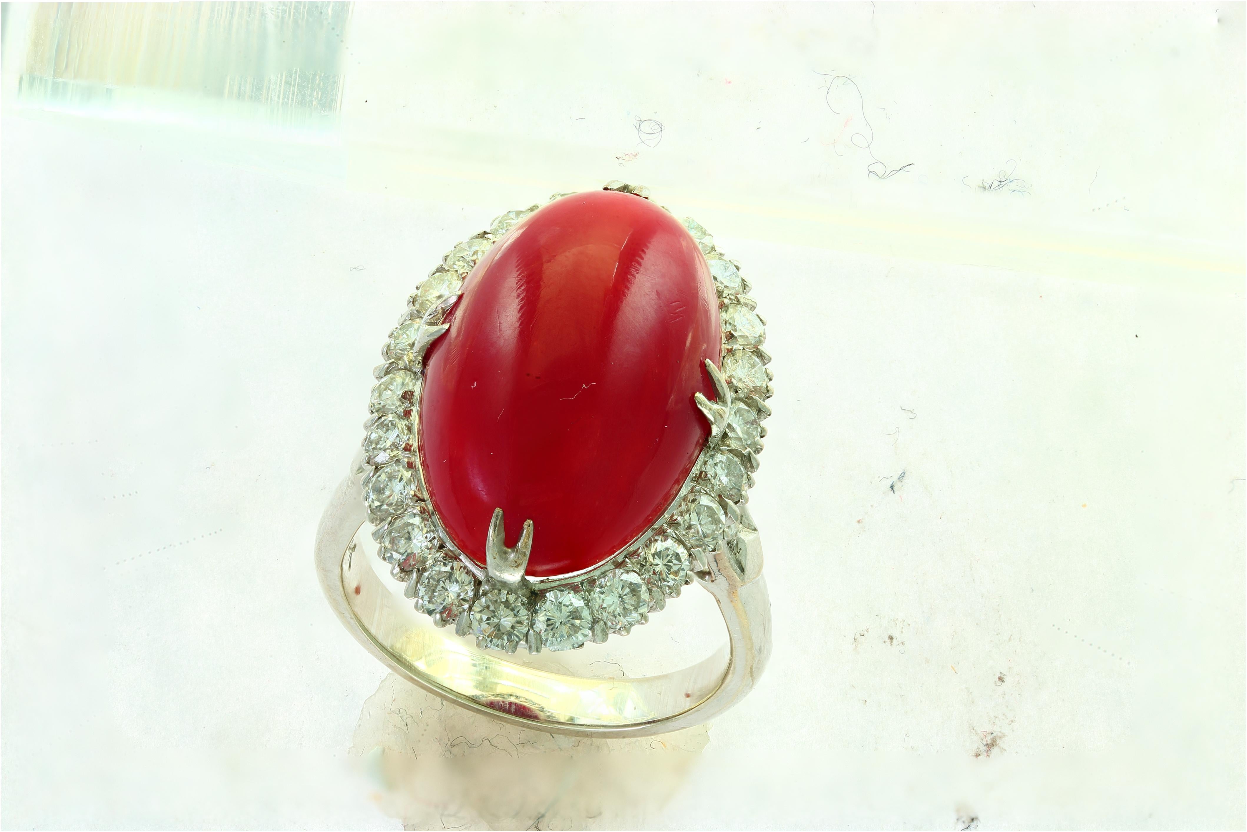 This extraordinary approximately 10 carat natural Coral is truly an extraordinary gemstone. 
1.5 carats of shimmering white diamonds
14 Karat white gold 8 grams 
Intricate work on the sides of the ring 
Ring size 6.5
If you need the ring resized, it