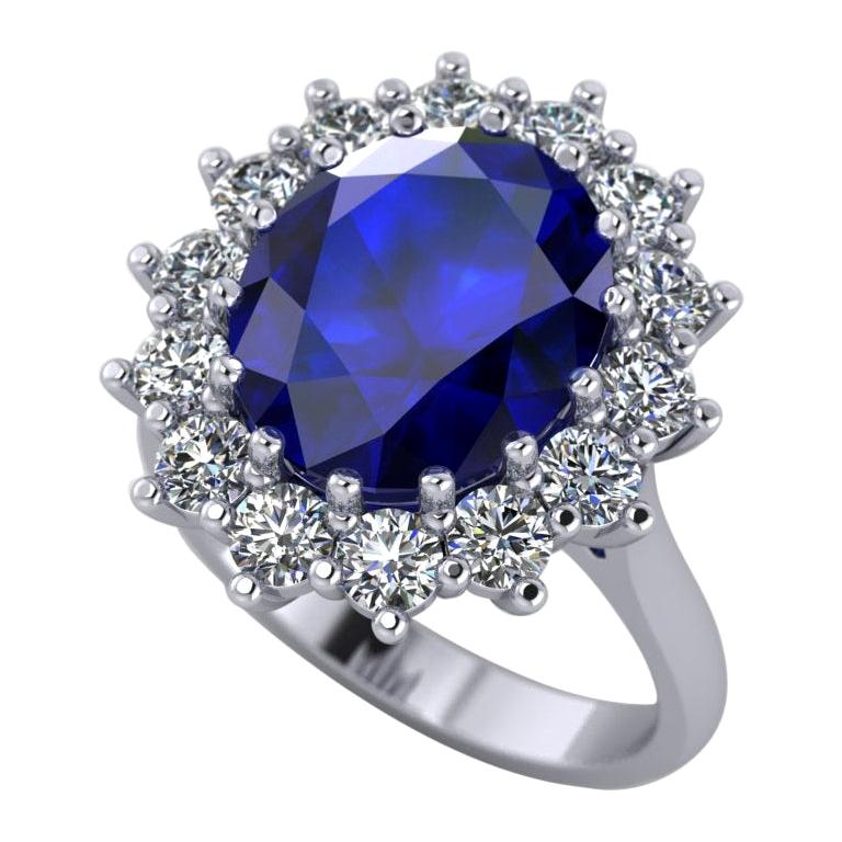 1.5 Carat, Oval Cut Sapphire and Diamond Halo Engagement Ring For Sale
