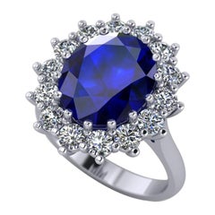 1.5 Carat, Oval Cut Sapphire and Diamond Halo Engagement Ring