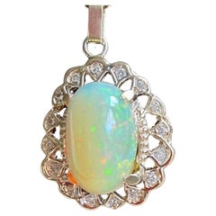 15 Carat Oval Ethiopian Opal & Diamond Pendant 14 Karat Yellow Gold Necklace