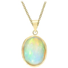 15 Carat Oval Ethiopian Opal Pendant / Necklace 14 Karat Yellow Gold Necklace