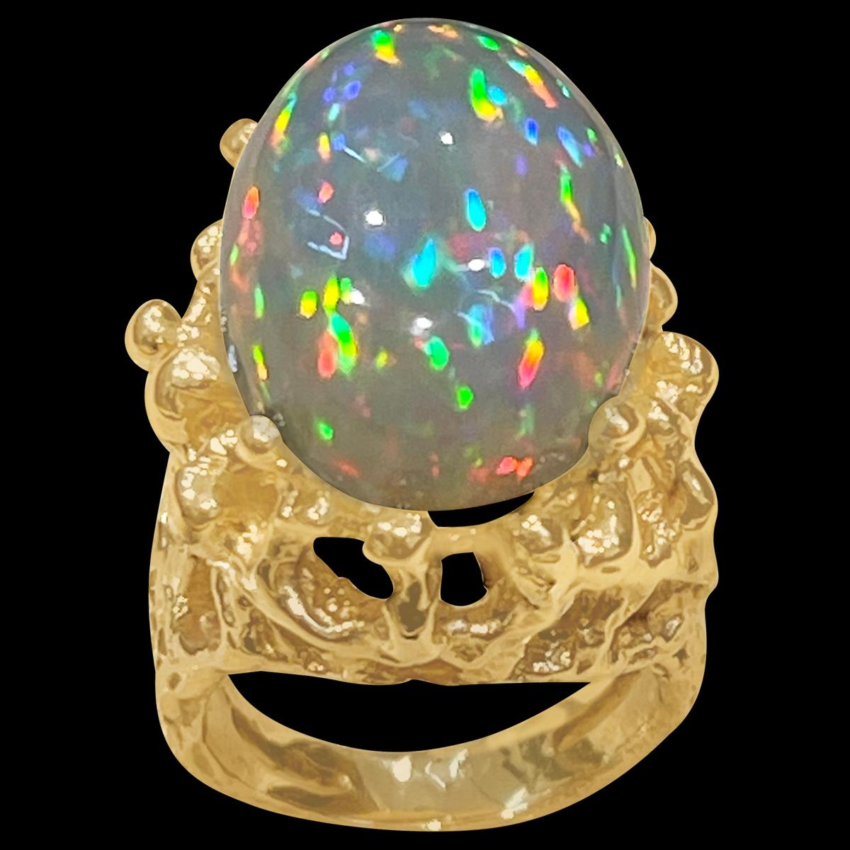 17.22  Carat Oval Shape Ethiopian Opal Cocktail Ring 14 Karat Yellow Gold size 6
Oval  Natural Opal  A classic, Cocktail ring , Very solid make d
14 Karat Yellow Gold Estate
Size of the opal 20 X 15 MM, 17.22 exact weight
Amazing colors in this opal