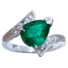 1.5 Carat Pear Cut Emerald and Diamond Ring 14 Karat White Gold
