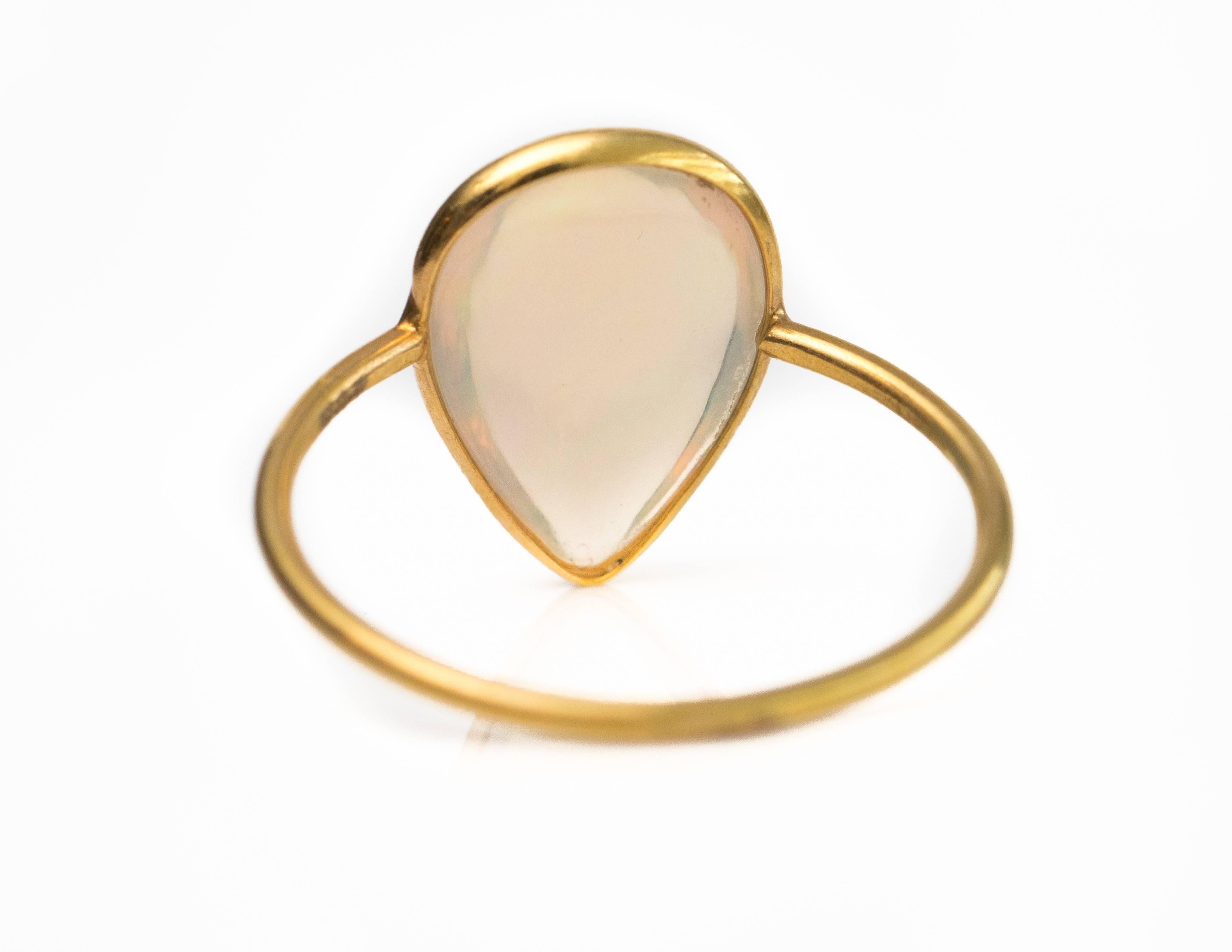 Modern 1.5 Carat Pear Cut Ethiopian Opal 18 Karat Yellow Gold Ring For Sale