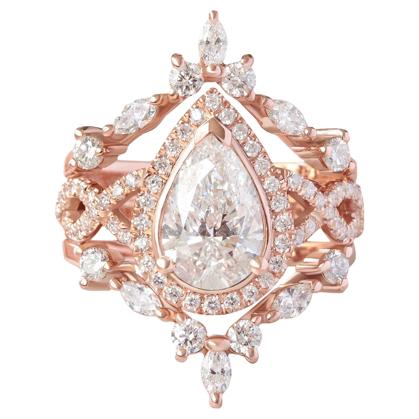 Verlobungsring 'Romeo' mit 1,5 Karat birnenförmigem Diamant-Twist-Halo im Angebot