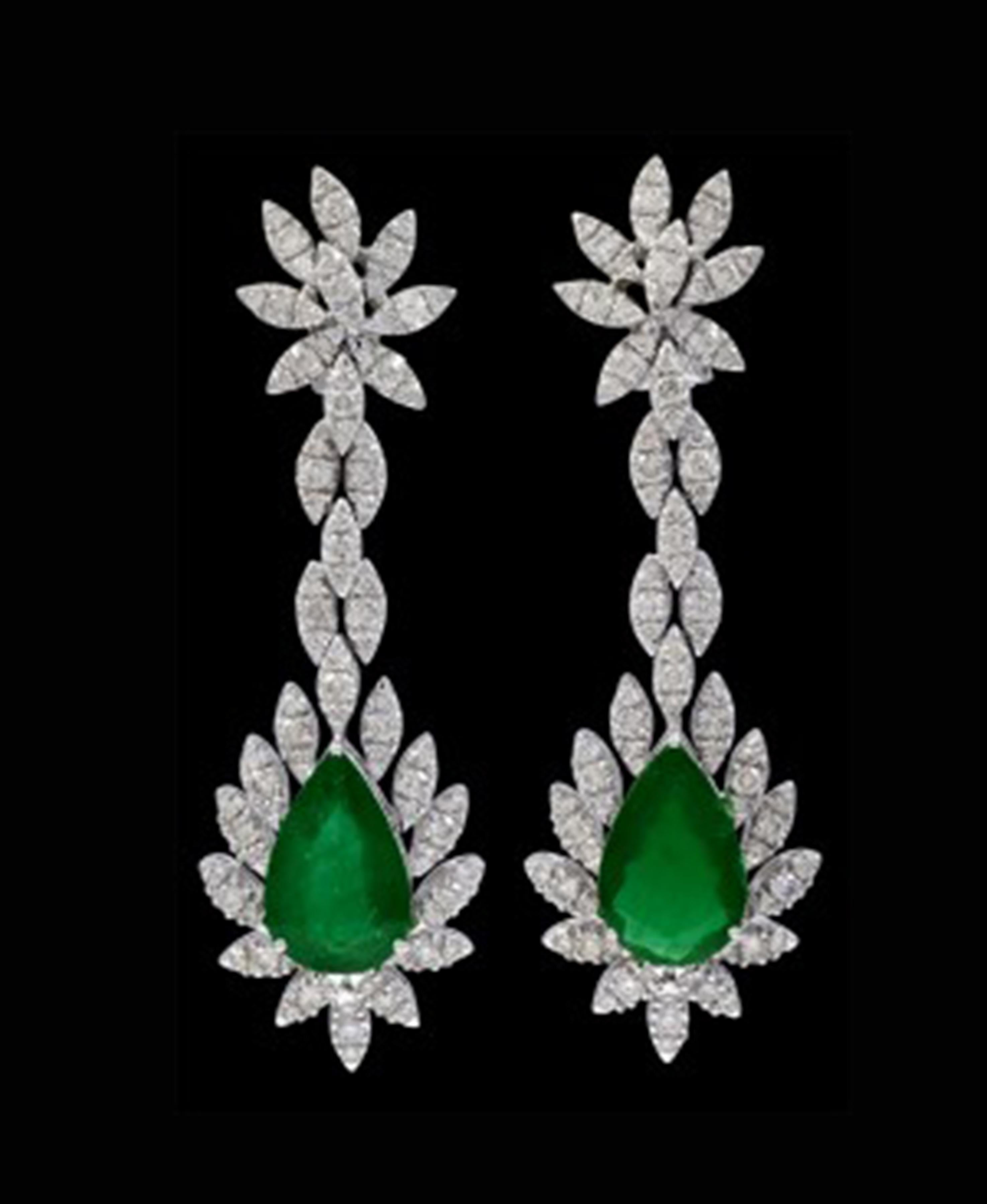15 Carat  Pear Shape Emerald Diamond  Hanging Earrings 18 K White Gold
This exquisite pair of earrings are beautifully crafted with 18 karat White gold  weighing    
 24 grams
Two fine Natural  Pear  Cut Emeralds weighing approximately 15 carats