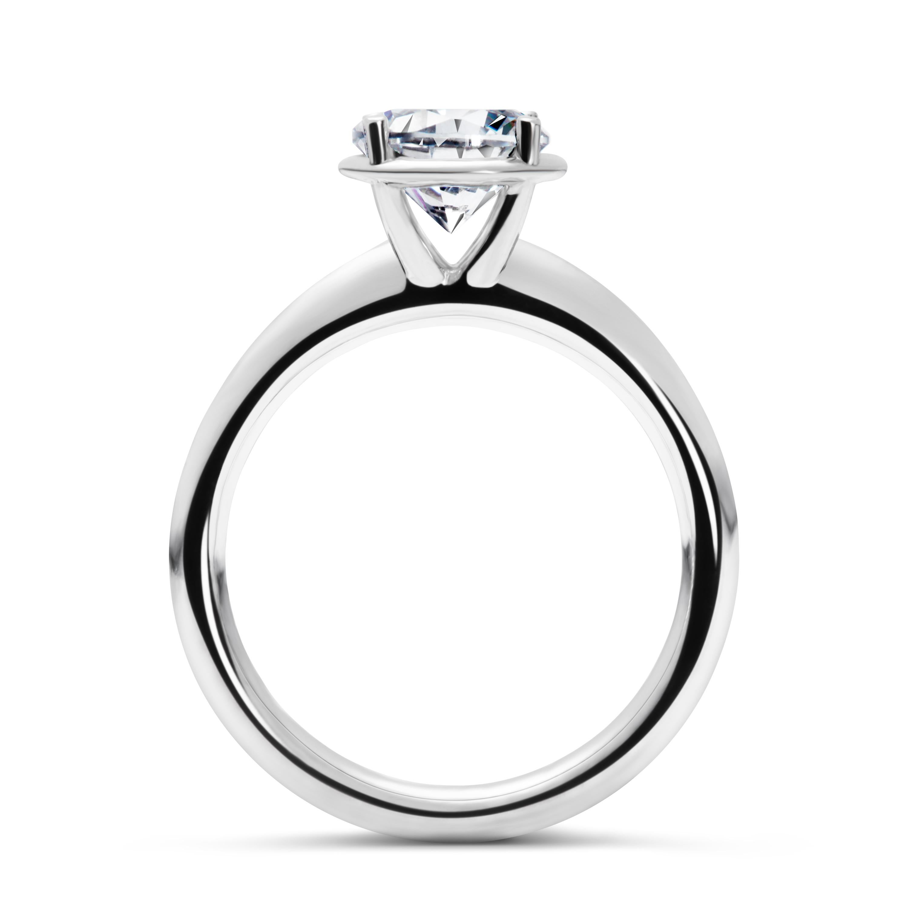 The No.1 Solitaire ring is designed to maximise the brilliance and luminosity of the diamond. Our distinctive halo is carefully engineered to elevate the diamond, emphasizing its size while strengthening and protecting the stone’s integrity. The