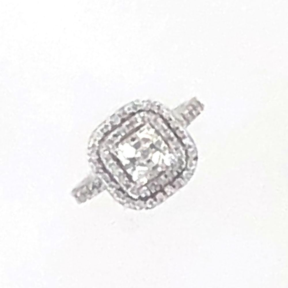This gorgeous diamond engagement ring features a 1.05 carat square emerald cut diamond surrounded by a two row halo of diamonds. The GIA certified emerald cut diamond is graded H color and VS2 clarity. The mounting is fashioned in 18 karat white