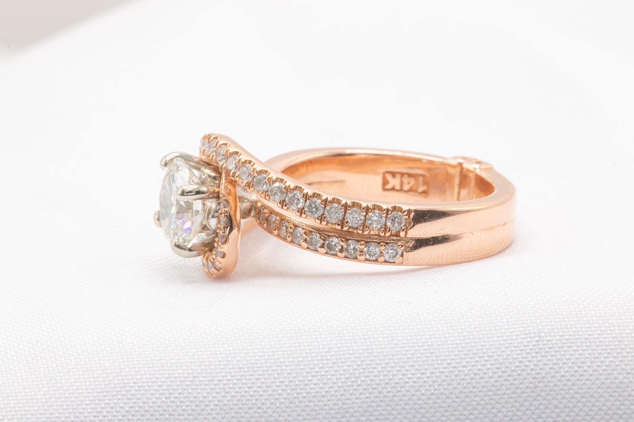This stunning bypass design ring is crafted in 14k rose gold, offering a perfect blend of classic elegance and modern flair. The centerpiece is a GIA-certified 0.98-carat diamond, graded I color and VS2 clarity, complete with an online GIA report. 