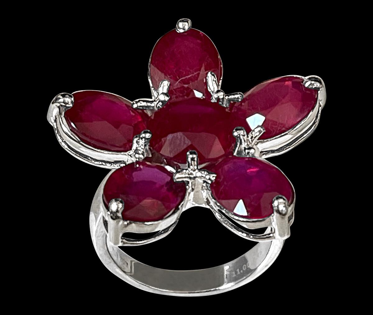 Approximately 15 Carat Treated Ruby Big Flower Cocktail Ring In 18 Karat White Gold  Size 6.5
 prong set
18 K White Gold: 10.7  gram with stone
Stamped 750
Ring Size 6.5 ( can be altered for no charge )
Large 5 Petals are surrounding a center Round