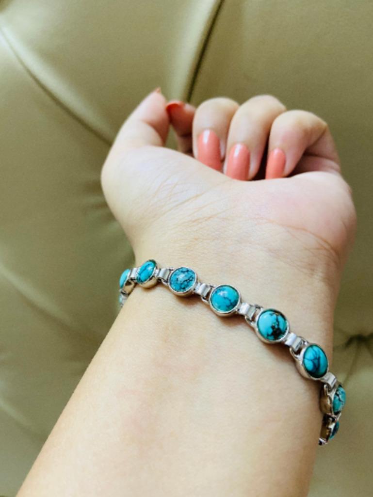 Beautifully handcrafted silver 15 Carat Turquoise Chain Bracelet, designed with love, including handpicked luxury gemstones for each designer piece. Grab the spotlight with this exquisitely crafted piece. Inlaid with natural turquoise gemstones,