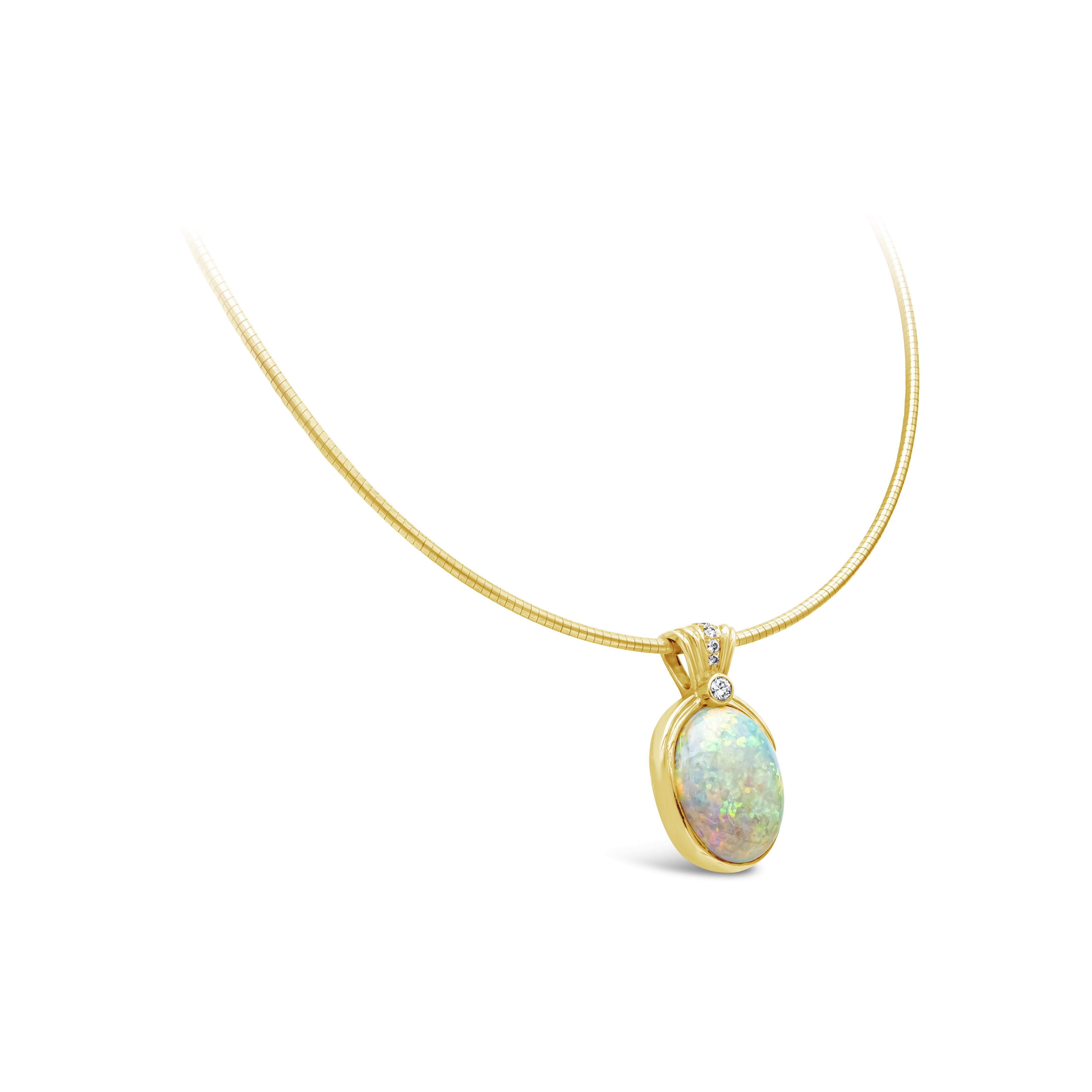 This beautiful necklace showcases a single oval 15.00 carat white opal. Accented with seven brilliant round diamonds. Diamonds weighing 0.27 carats total, F color and VS clarity. Necklace made in 14 and 18 karat yellow gold.