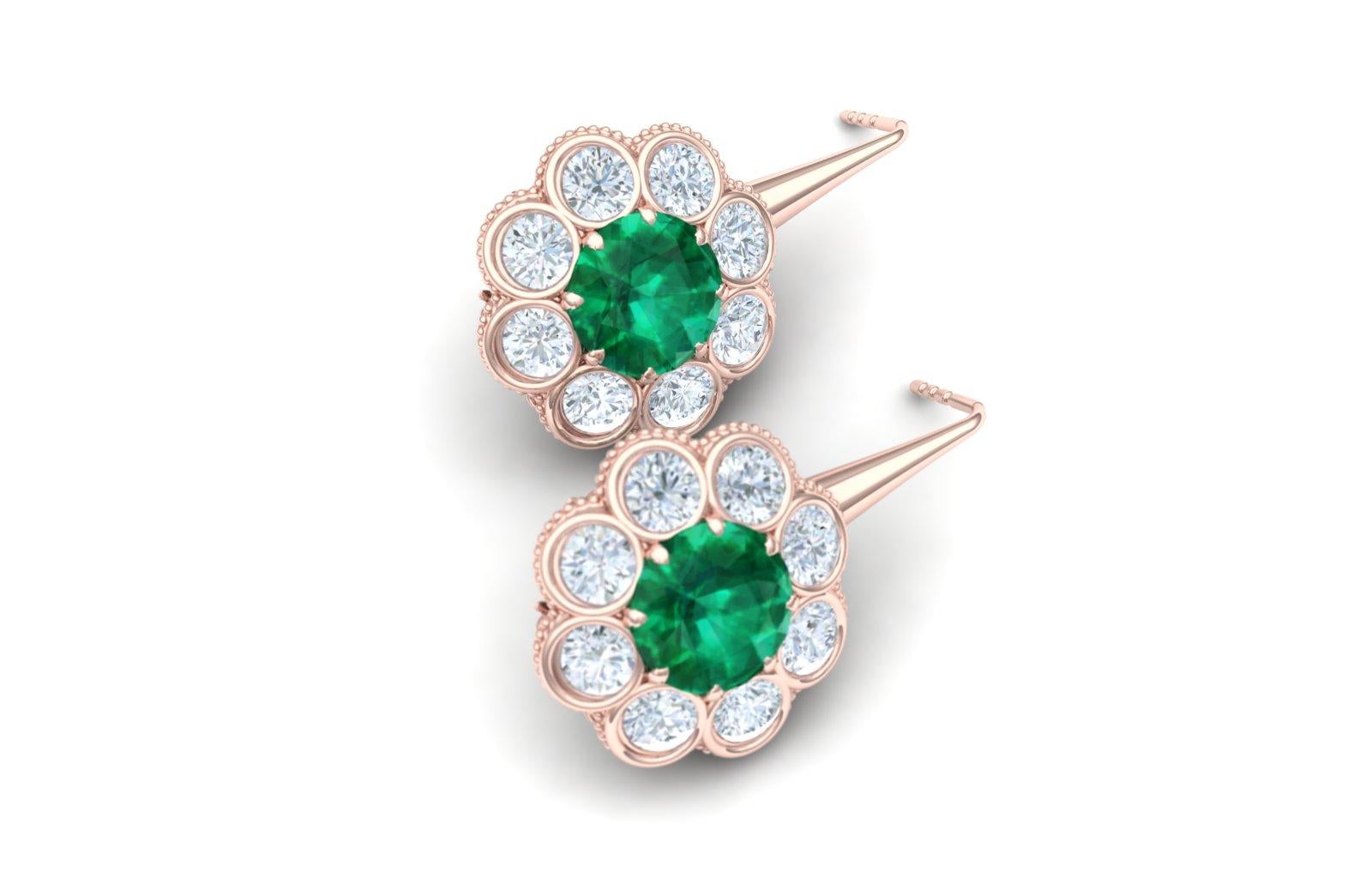 These classically inspired emerald and diamond earrings are perfect to wear daily or dress up. The center of each earring is apprx. .50 carat round emerald set with .30 ctw apprx. of white round brilliant diamonds. The diamonds have a color and