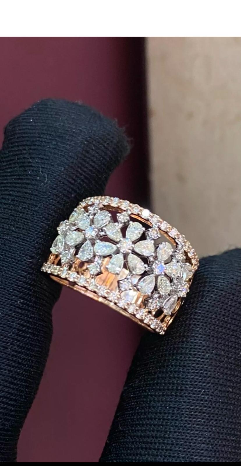 This stunning 1.51 carat pear and round shape natural diamond engagement band ring is a true beauty. The ring is made of 14k rose gold and features a pavé setting style with a slight inclusivity (SI1) diamond clarity grade. The band is also