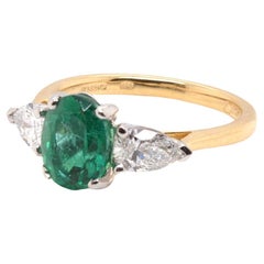 Retro 1.5 carats oval emerald and diamonds ring