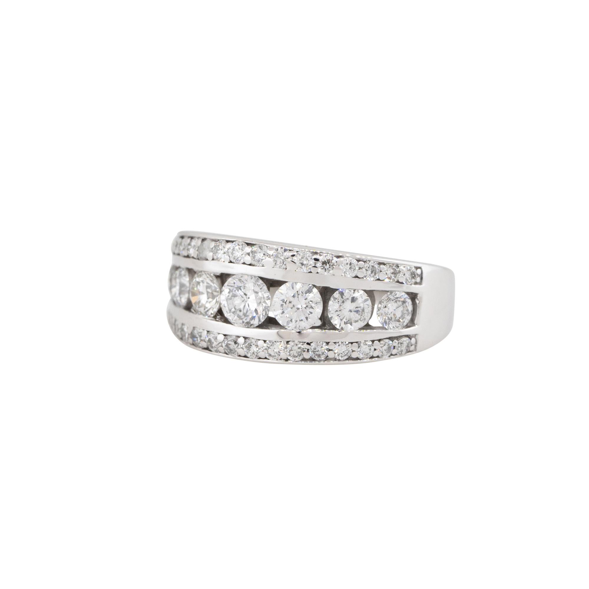 14k White Gold 1.5ctw Round Brilliant Diamond 3 Row Graduated Band

Material: 14k White Gold
Diamond Details: All Diamonds are Round Brilliant cut, weighing approximately 1.50 carats in total. There are 7 larger, graduated stones in the center,