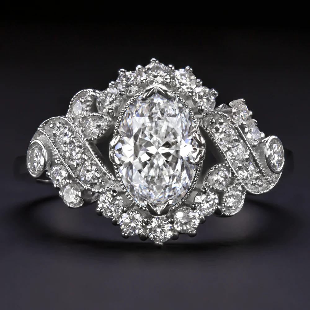 Stunning diamond ring with brilliant brilliance, beautiful colors and a glamorous vintage inspired design!
The beautiful oval cut diamond is brilliant and colorless diamond and it is set in an elegant diamond-encrusted frame that offers a very