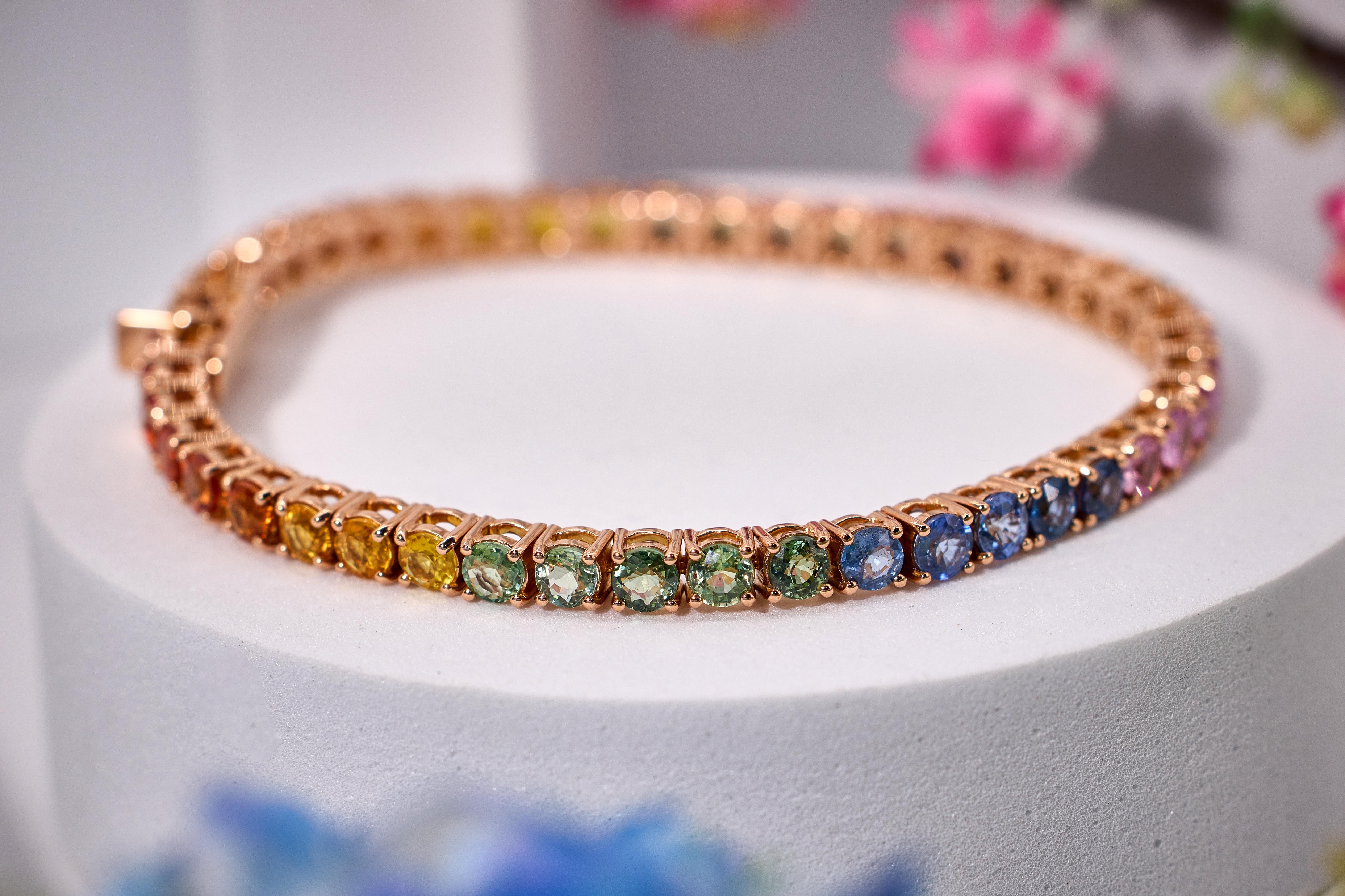 15.46 carats in natural Sapphires sourced from miners in Madagascar, Sri Lanka and Burma are brilliant cut and set in 18k Rose gold. This tennis bracelet is made of natural earth mined sapphires. Each sapphire is 4mm wide. The total thickness of the