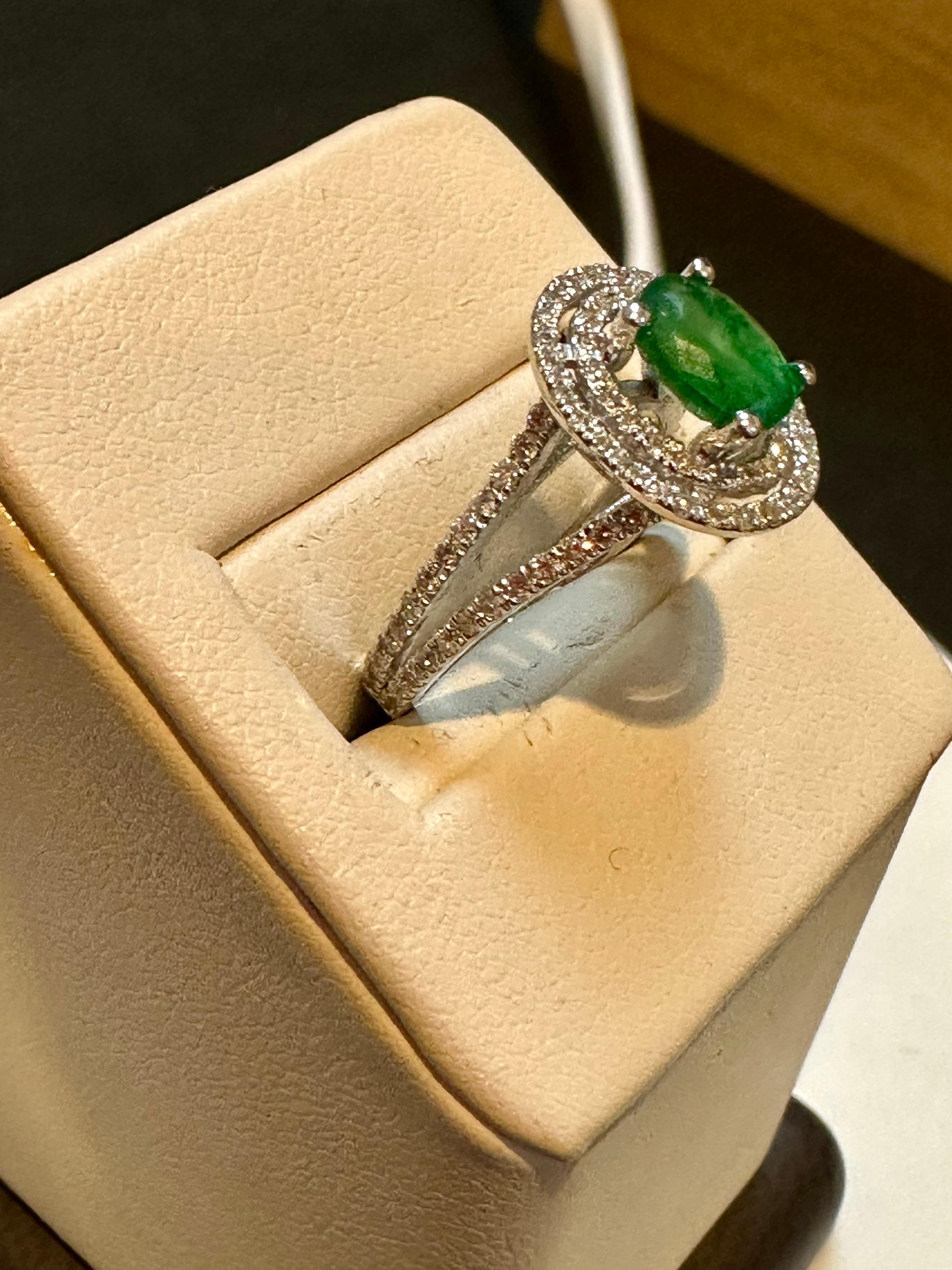 Natural 1.5 Ct Oval Cut Natural Emerald & 2 Ct Natural Diamond Double Halo Engagement Ring size 6 in 14 K white Gold
Introducing a truly stunning piece, behold the 1.5 Carat Oval Natural Zambian Emerald & 2 ct Diamond Ring in exquisite 14 Karat