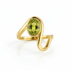 1.5 ct oval peridot silver, gold ring