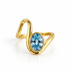 1.5 ct oval topaz silver, gold ring