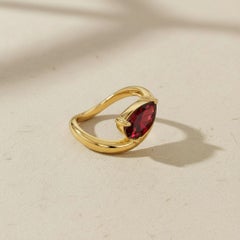 1.5 ct pear garnet silver, gold ring