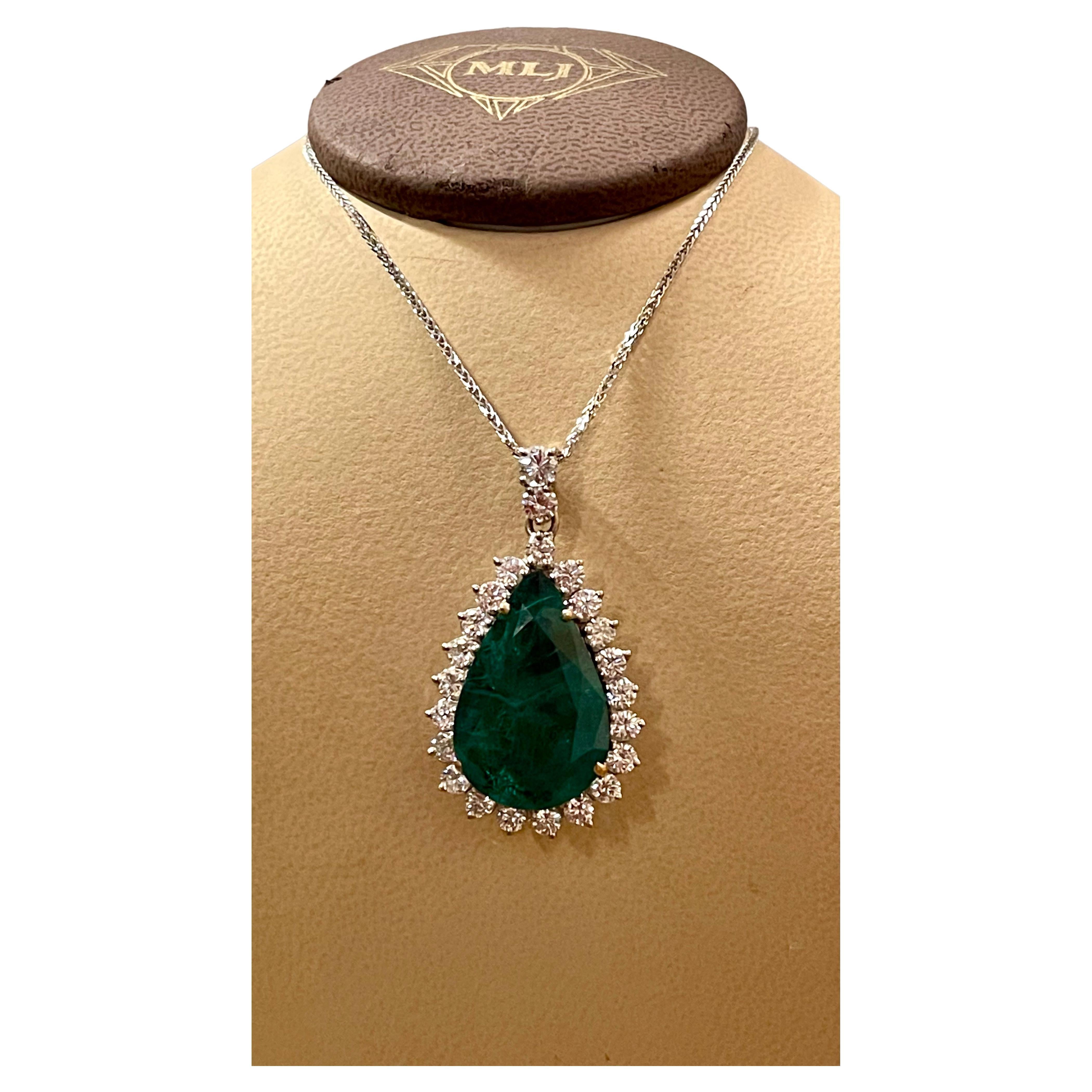 
15 Ct  Pear Hydro Emerald & 4 Ct Diamond Pendent/Necklace 18 Kt White Gold 
large, breathtaking, statement  Emerald and diamond necklace. This eye-catching pendant necklace features a 4.0 ct total weight of brilliant round  diamonds surrounding